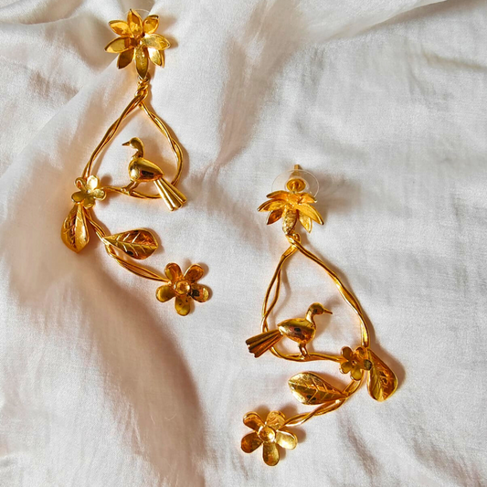 Resting Bird earrings with floral branches and perched bird, crafted in brass with 18K rhodium gold plating
