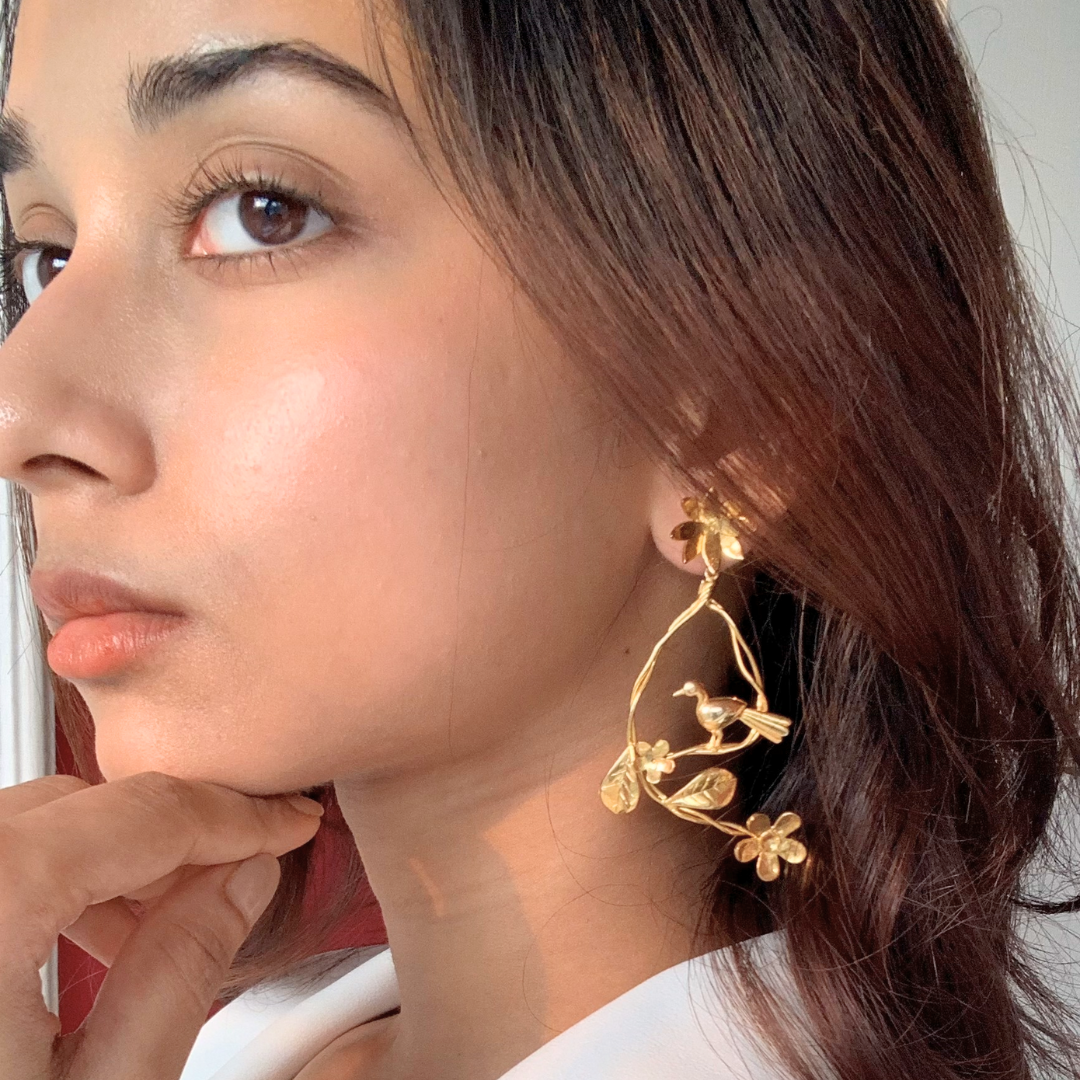 Resting Bird earrings with floral branches and perched bird, crafted in brass with 18K rhodium gold plating