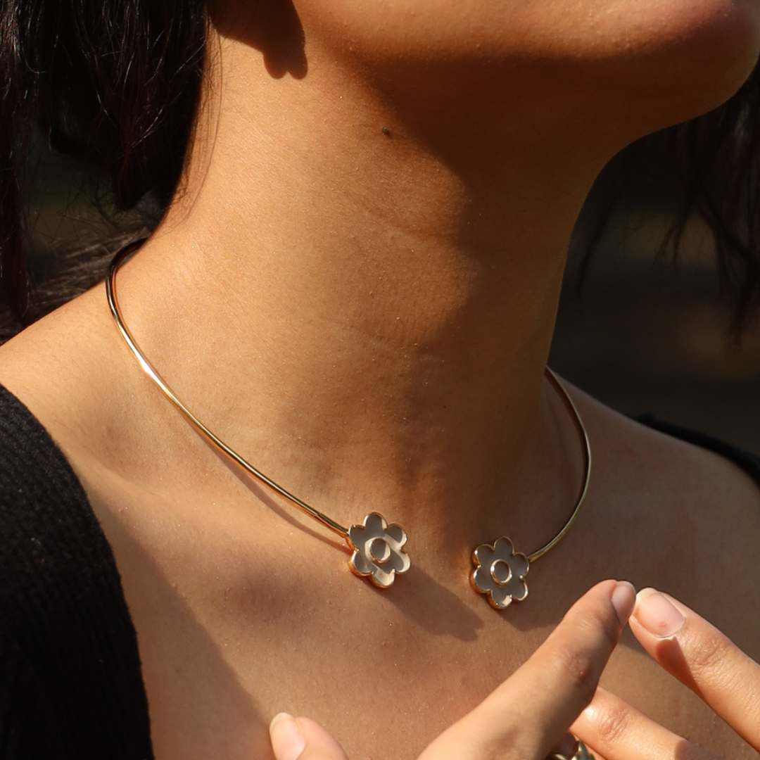 Handcrafted floral cement and brass torc necklace with 18K rhodium gold plating