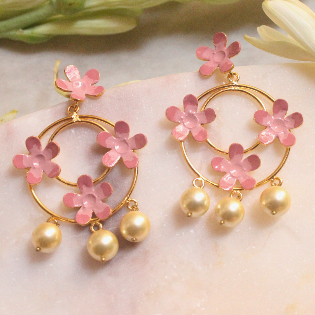 Handcrafted brass hoop earrings with pink enamel flowers and pearl drops