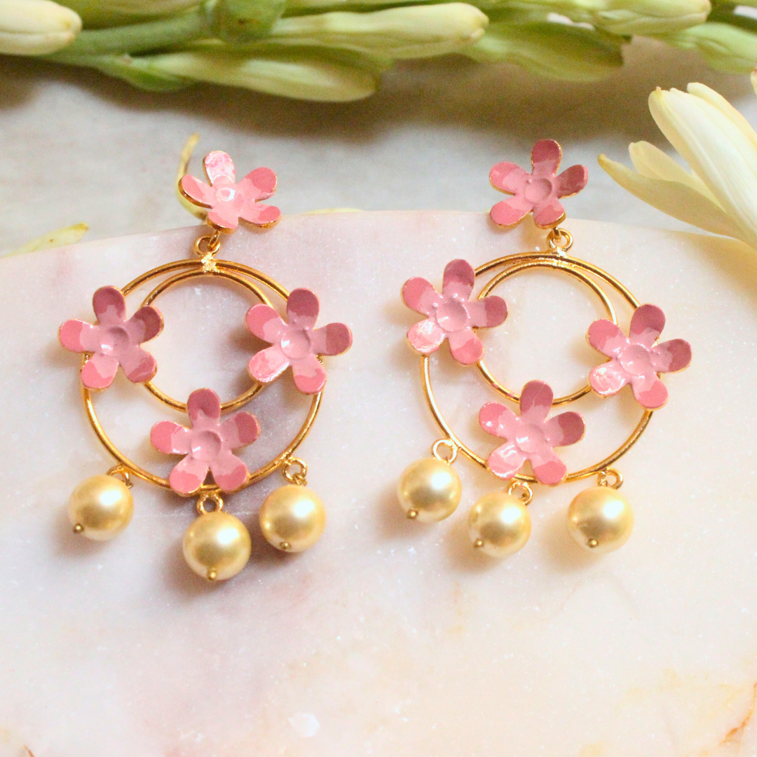 Handcrafted brass hoop earrings with pink enamel flowers and pearl drops