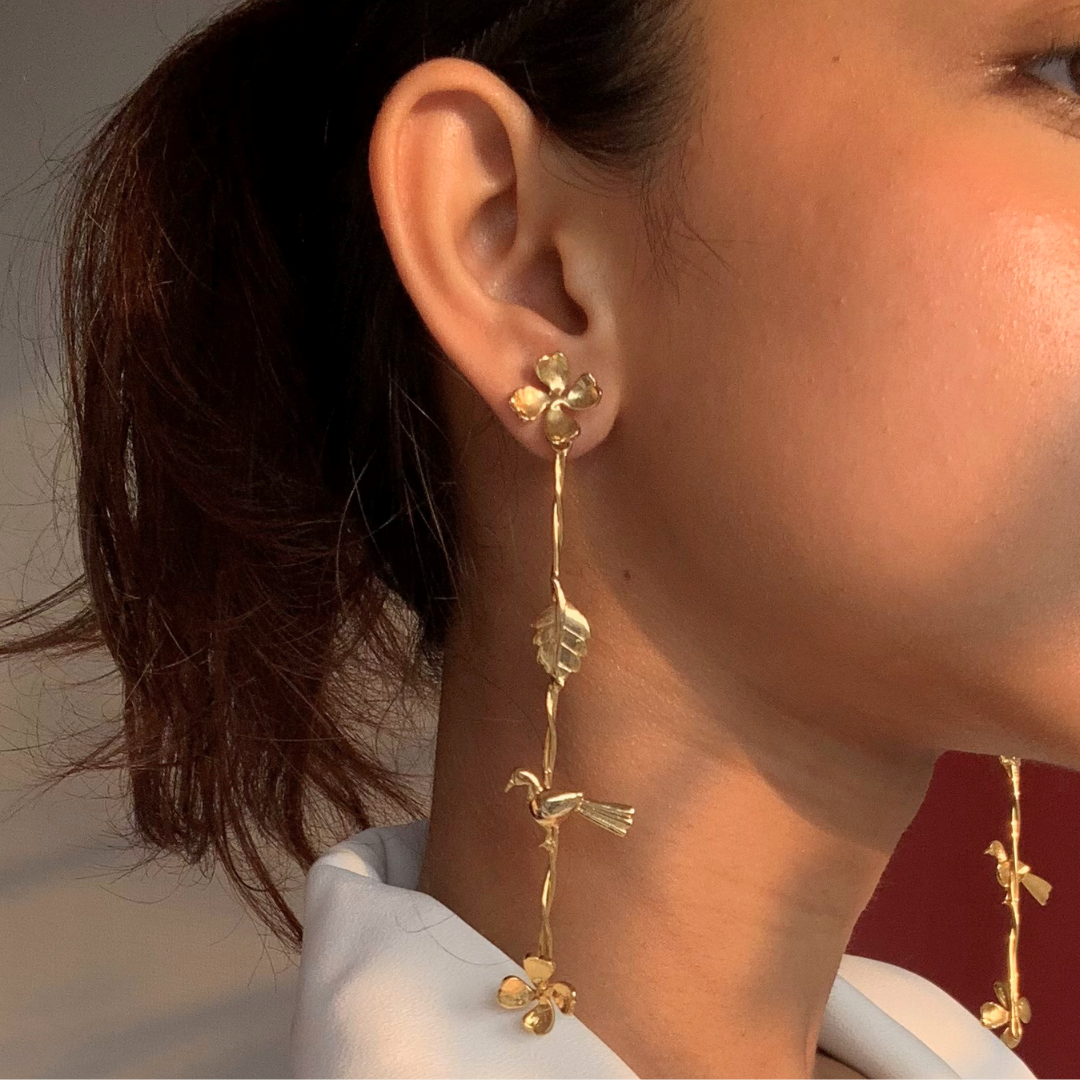 Gold Plated Long Dangler Earrings Featuring Delicate Twisted Stems, Floral Motifs, Textured Leaves, and Small Perched Birds