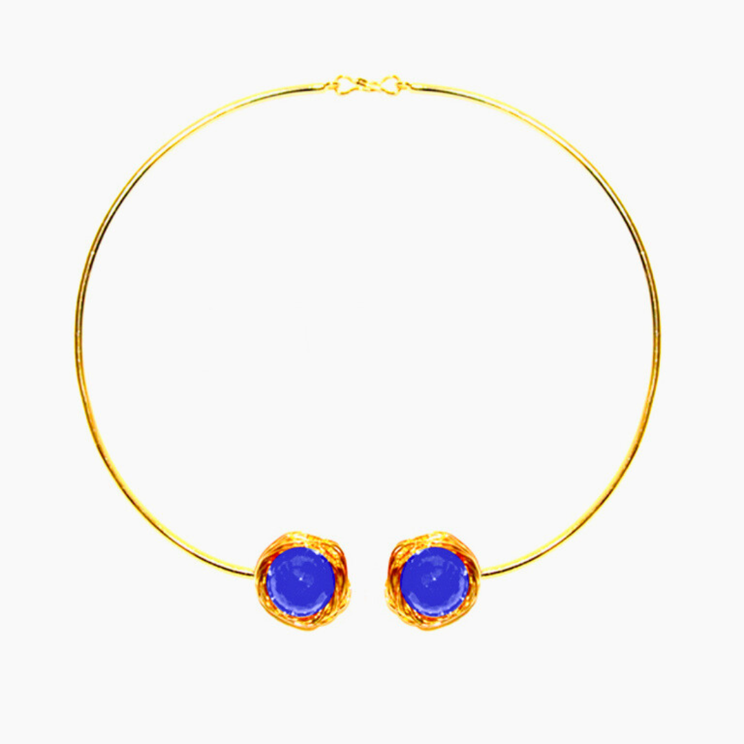 Handcrafted Torc-style necklace featuring two faceted blue onyx stones wrapped in golden wire on an open choker brass band with 18K rhodium gold plating