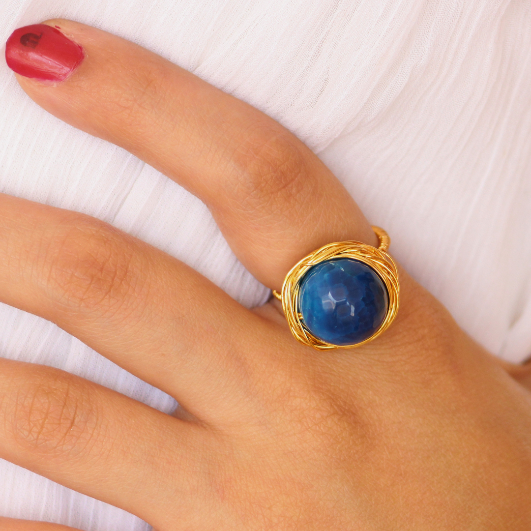 Handcrafted Blue Onyx Ring featuring a deep oceanic faceted gemstone set in a twisted brass band with 18K rhodium gold plating