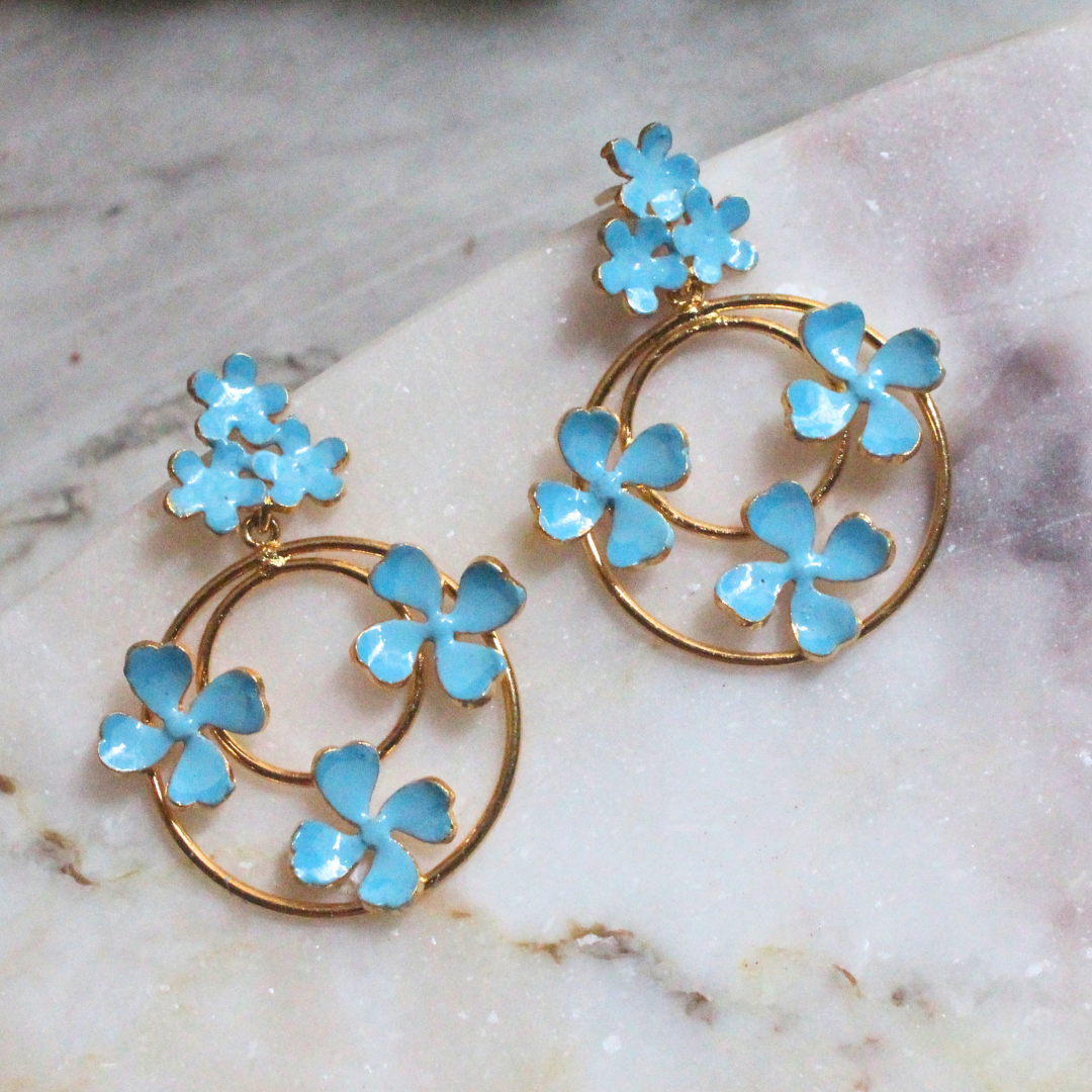 Blue Enamel Dangler Earrings featuring concentric gold-plated brass hoops adorned with delicate sky-blue enamel flowers