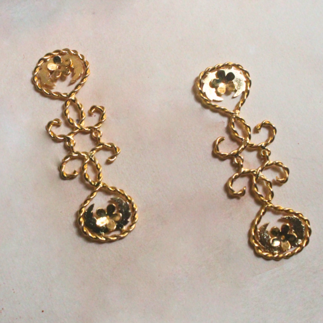 Gold-plated brass earrings with twisted rope detailing and delicate floral accents, forming a cascading silhouette