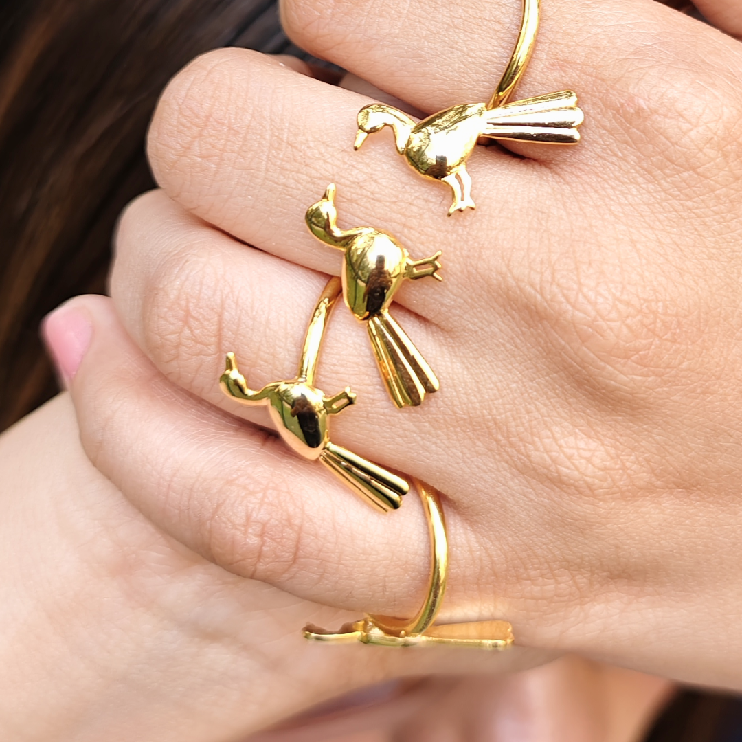 Brass gold-plated open ring featuring a single sculpted bird in flight