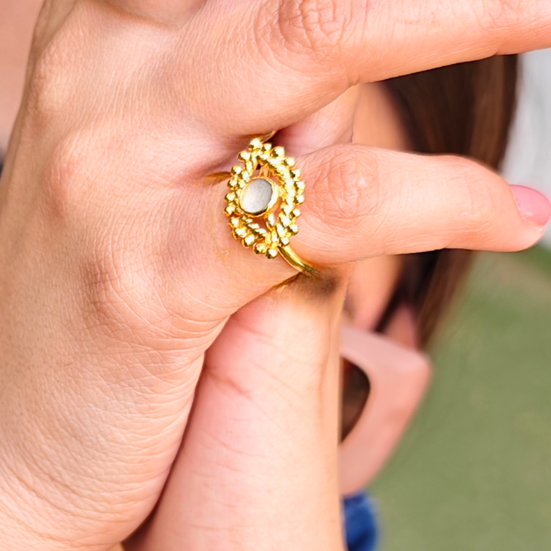 Gold-plated Cement Ember Ring with a smooth cement center and intricate beaded halo design
