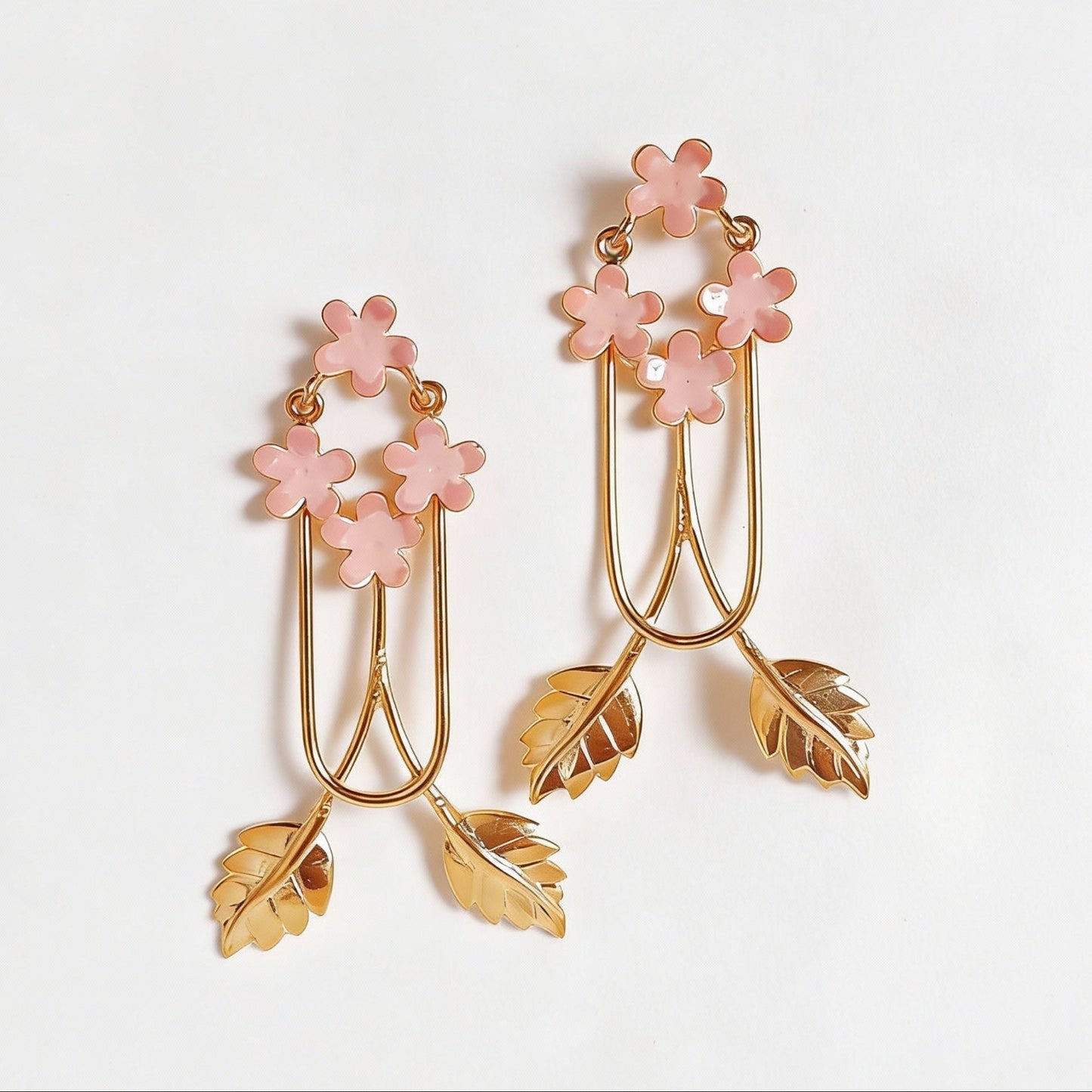 Pair of floral earrings with pink enamel flowers and gold leaves
