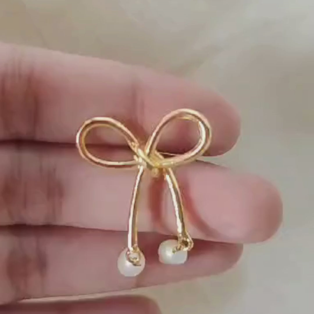 18K rhodium gold-plated bow earrings with dangling twin baroque pearls