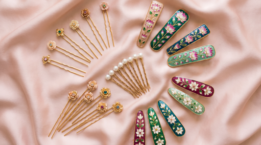 Floral gold hair pins, pearl bobby pins and enamel clips on pink fabric – KANSYA Jewellery