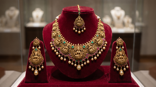 South Indian temple jewellery set with gold necklace and goddess motifs on red velvet – KANSYA Jewellery