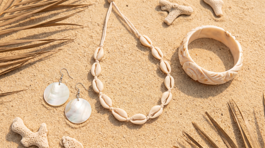 Cowrie shell necklace, mother-of-pearl earrings and shell bangle on tropical sand – KANSYA Jewellery