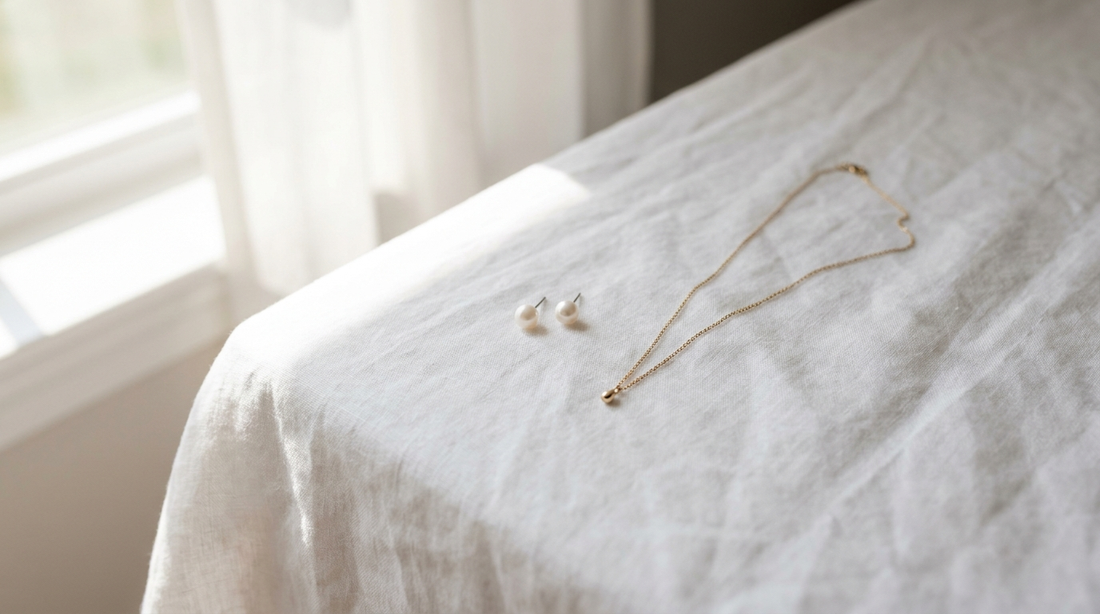 drop earrings styling guide India - elegant brass drop earrings on white fabric