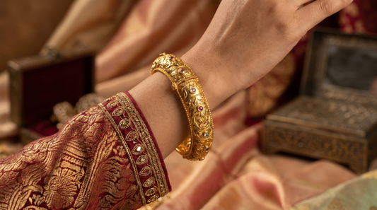 Indian woman's wrist with traditional gold kada bracelet jewellery editorial