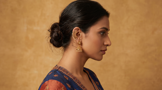 Indian woman wearing gold ear cuff with traditional jhumka earring ethnic outfit