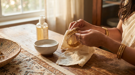 Woman cleaning gold-plated brass bracelet with soft cloth at home – KANSYA Jewellery