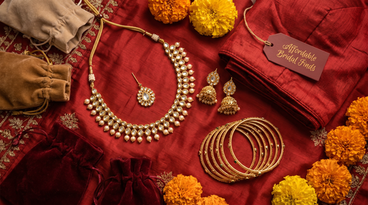 Affordable Indian wedding jewellery flat lay with jhumkas and bangles on red silk – KANSYA Jewellery