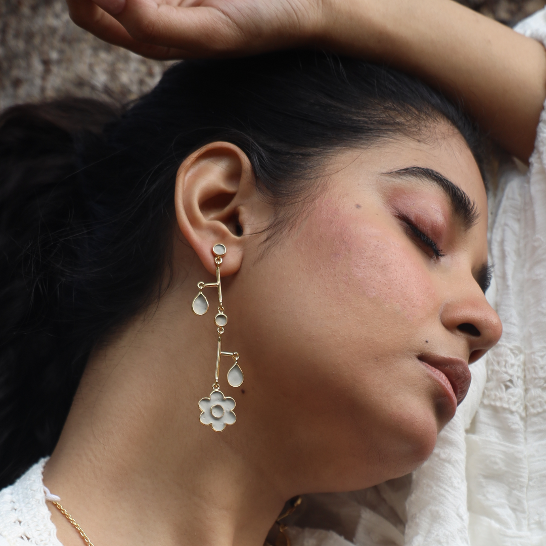 Balanced out cement earrings on a model