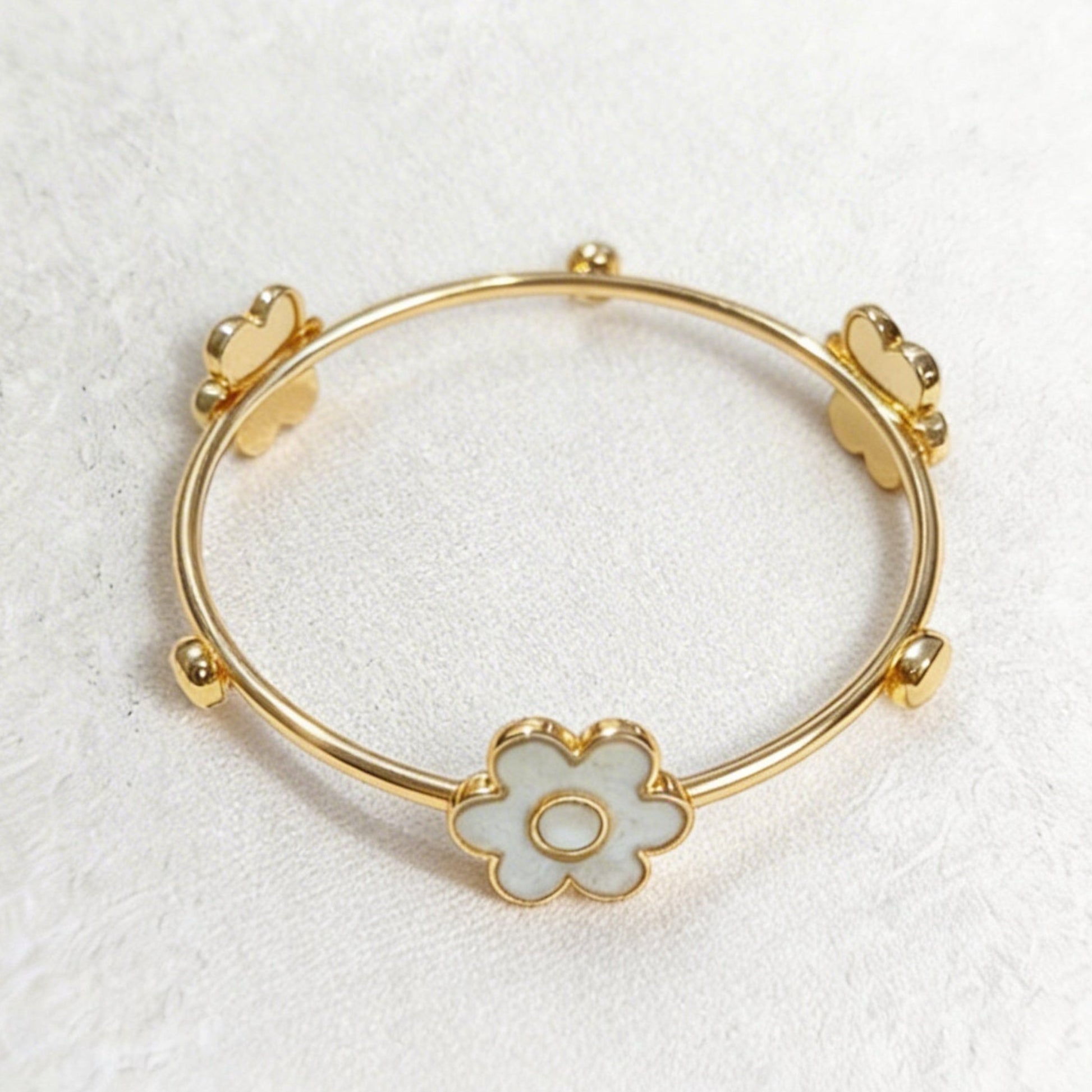 bangle with cement filled flower shapes