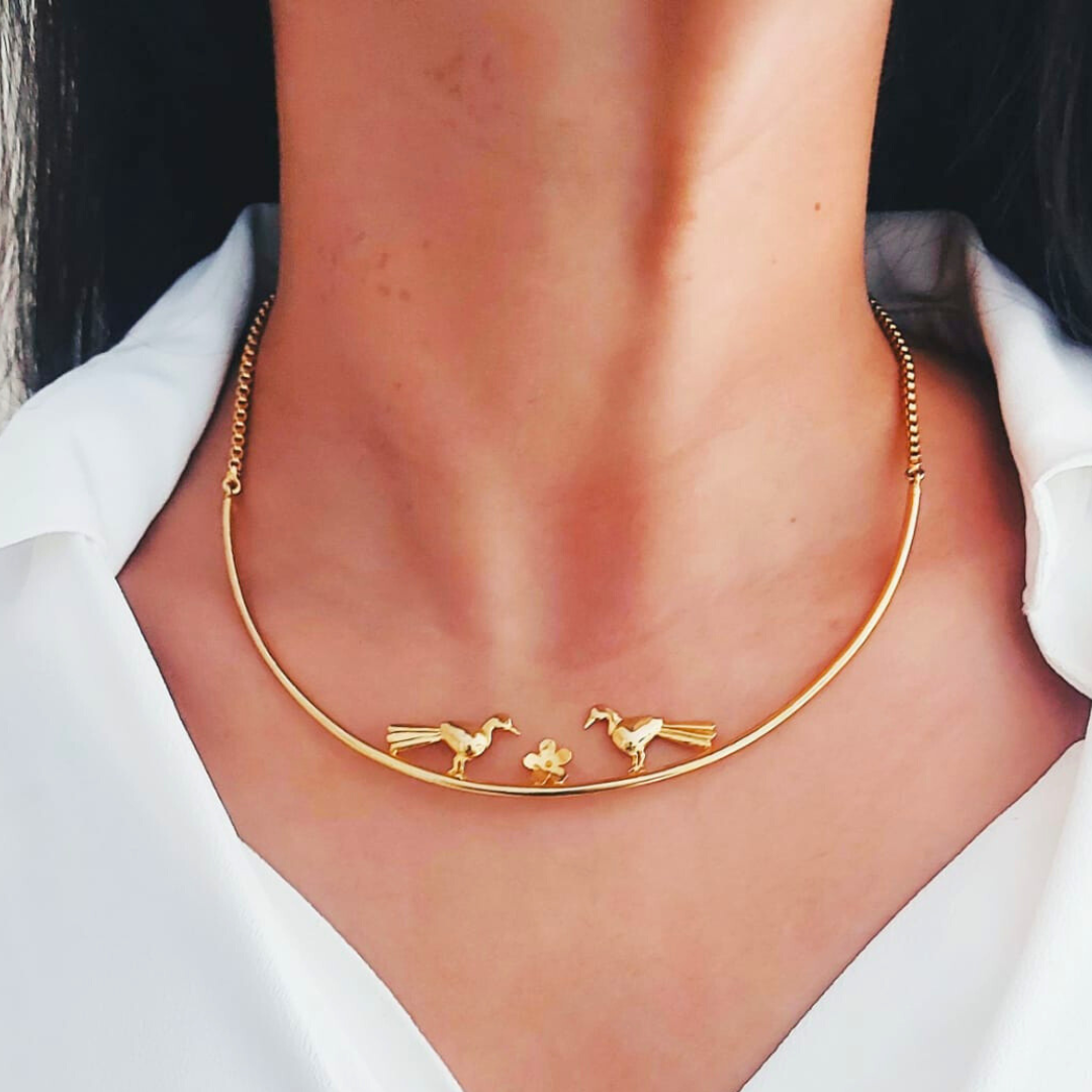 Love Birds necklace with sculptural birds and floral centerpiece, made from brass and 18K rhodium gold