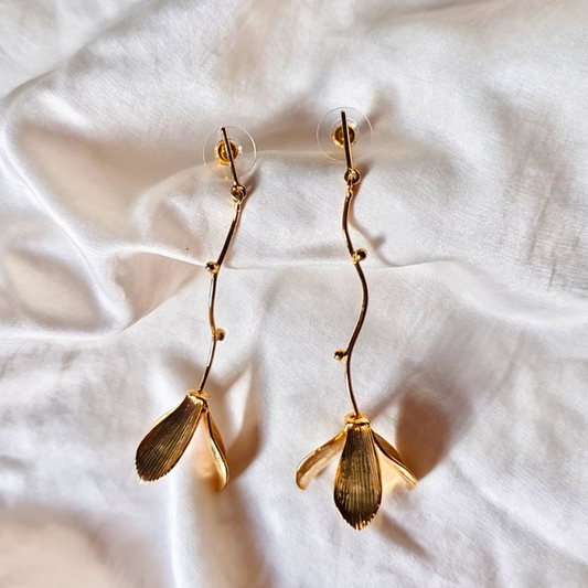 Hanging flower earrings with matte-gold petals and flowing vine stems, made from brass and 18K rhodium gold plating