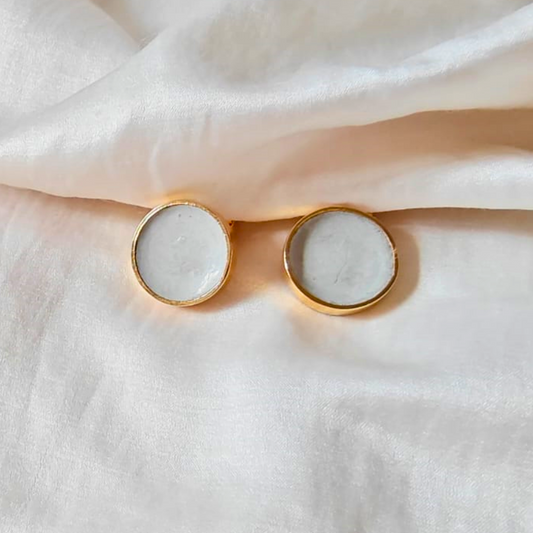 Handcrafted cement and brass round studs with 18K rhodium gold finish