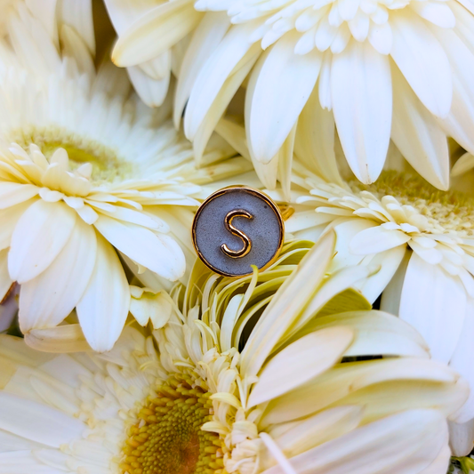 Handcrafted personalized alphabet ring made with cement and brass, finished in 18K rhodium gold