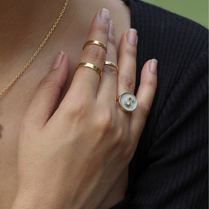 Handcrafted personalized alphabet ring made with cement and brass, finished in 18K rhodium gold