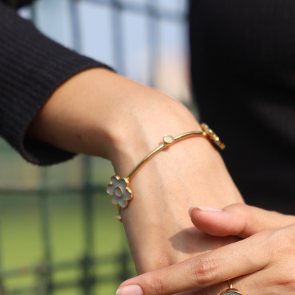 Handcrafted floral cement and brass bangle with 18K rhodium gold plating