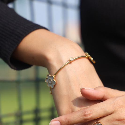 Handcrafted floral cement and brass bangle with 18K rhodium gold plating