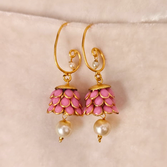 Pink acrylic jhumki earrings with lotus petal design, pearl drop, and 18K rhodium gold finish