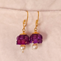 Lightweight purple jhumki earrings with layered acrylic petal dome and single pearl drop