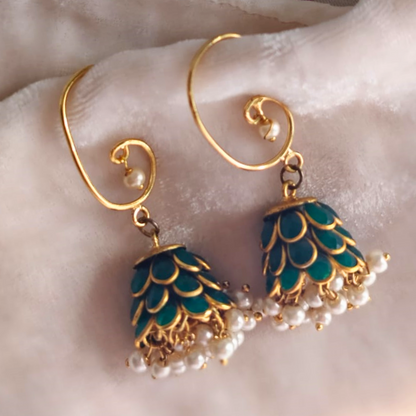 Green acrylic jhumki earrings with lotus petal design, pearl drops, and 18K rhodium gold finish