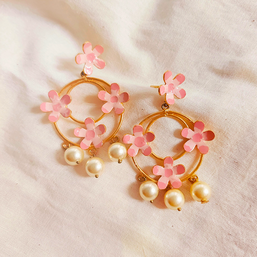 Handcrafted brass hoop earrings with pink enamel flowers and pearl drops