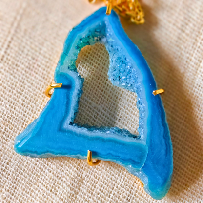 Blue druzy agate pendant with natural geode center on gold-toned brass chain