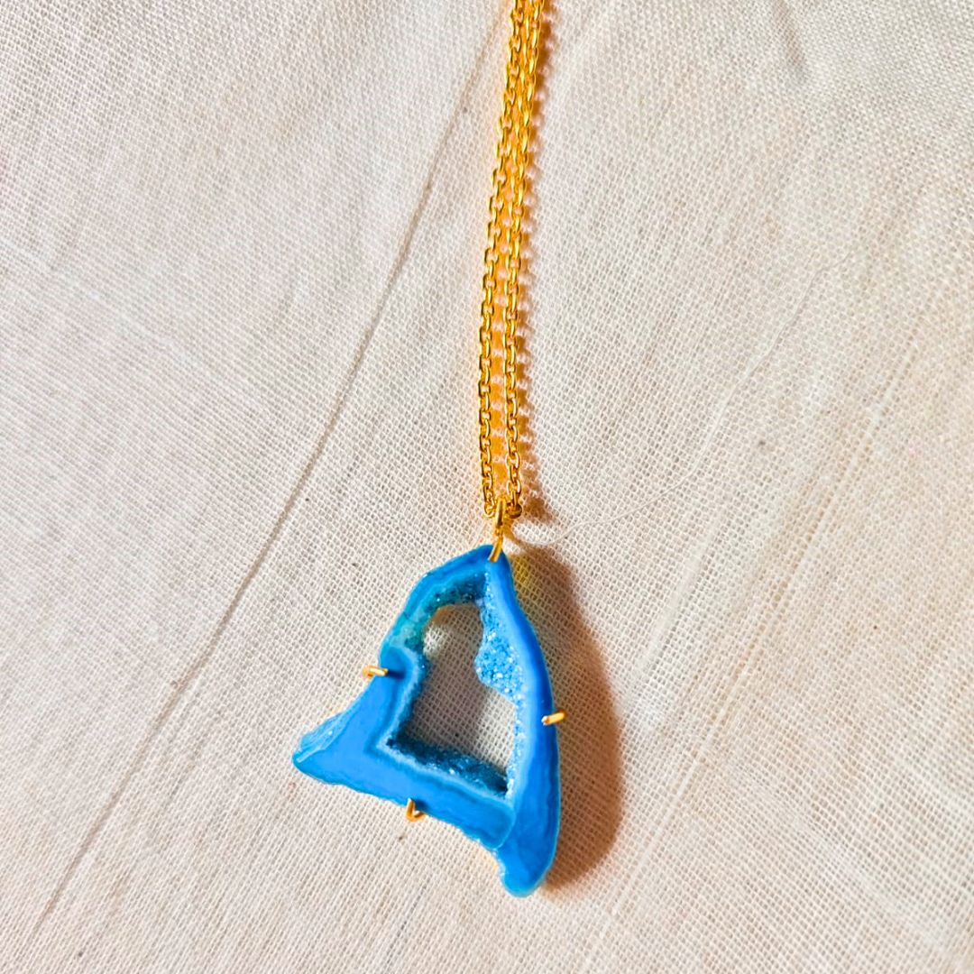 Blue druzy agate pendant with natural geode center on gold-toned brass chain