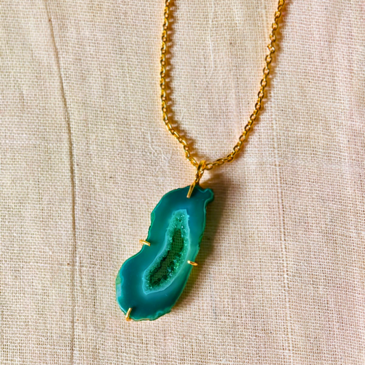 Green druzy agate pendant with natural geode center on gold-toned brass chain