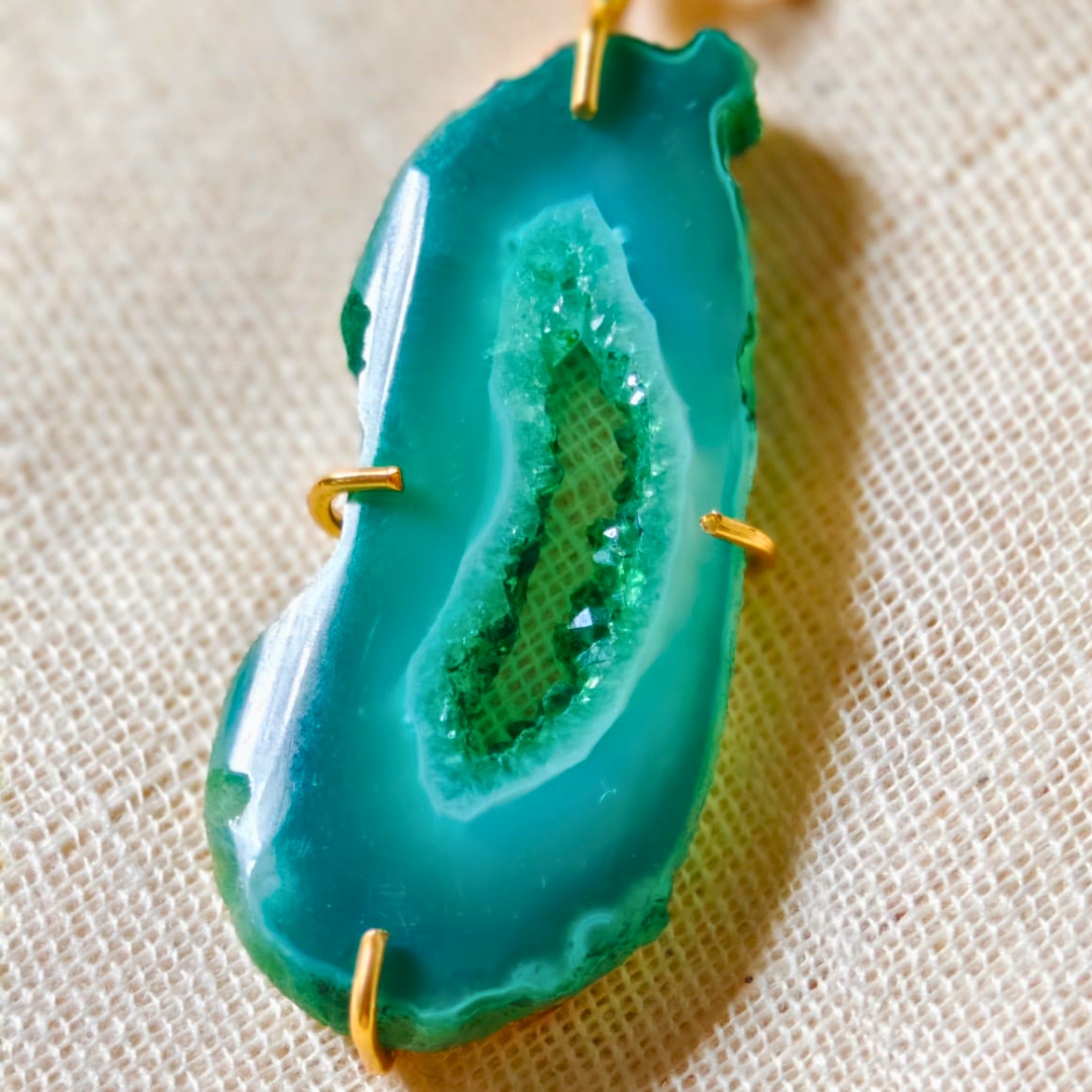 Green druzy agate pendant with natural geode center on gold-toned brass chain
