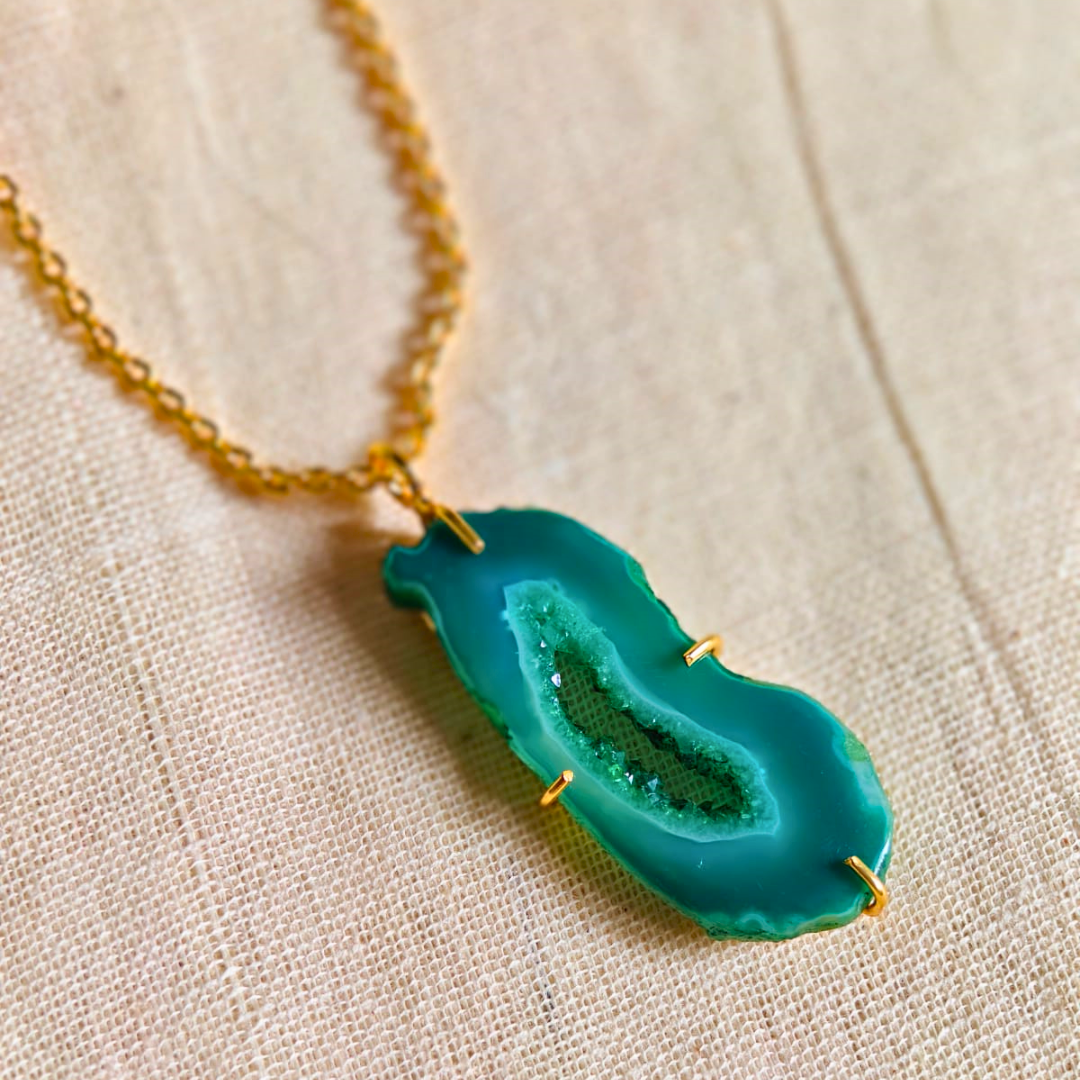 Green druzy agate pendant with natural geode center on gold-toned brass chain