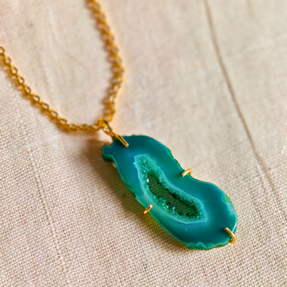 Green druzy agate pendant with natural geode center on gold-toned brass chain