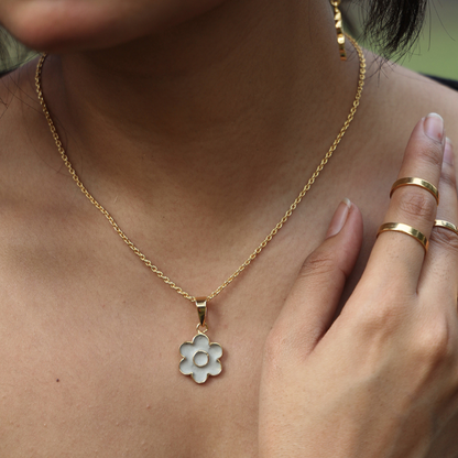 closeup of model wearing the floral cement pendant