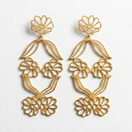 Gulnaar floral jaali danglers in rhodium-plated brass with intricate openwork flower design, lightweight Indian statement earrings.
