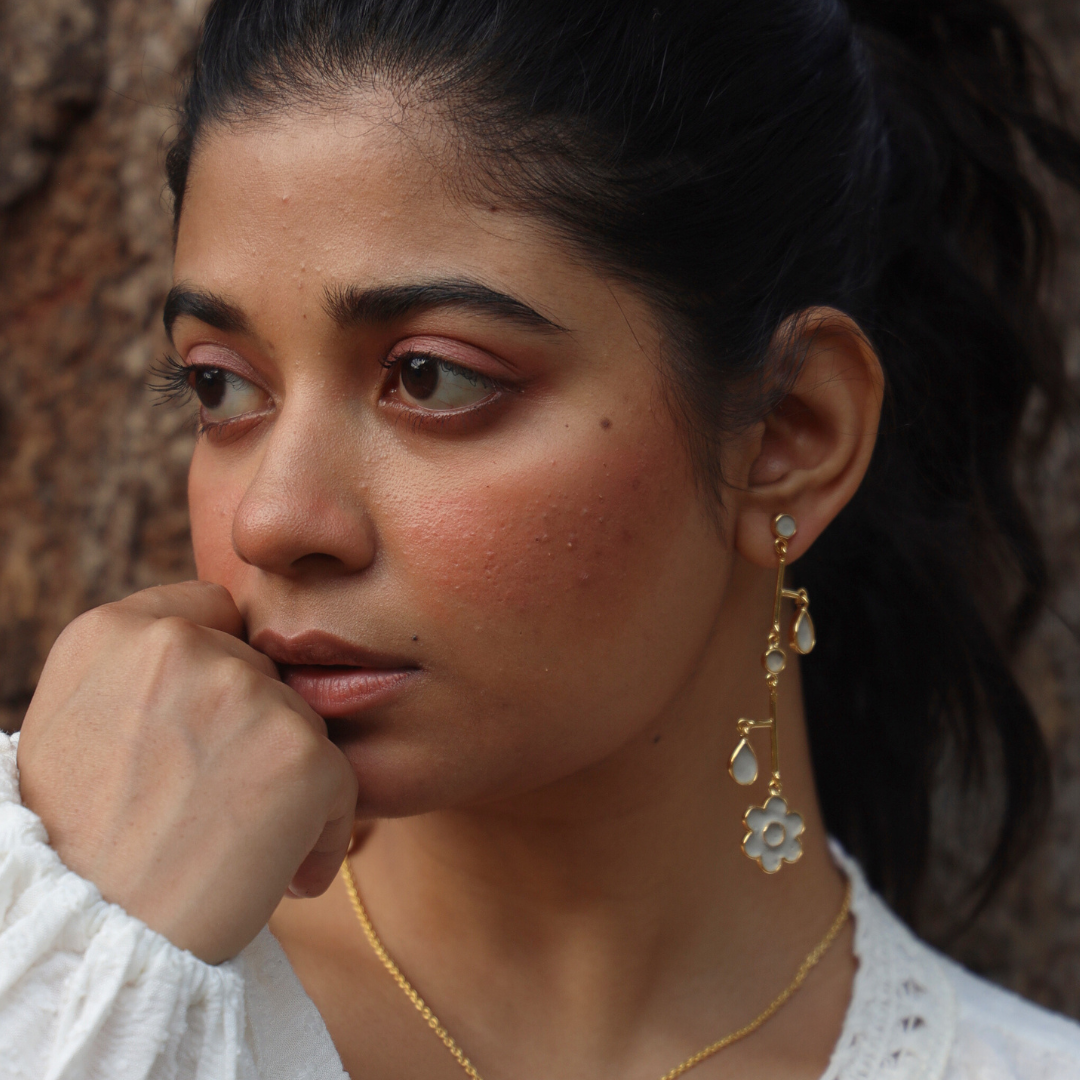 Balanced out cement earrings on a model in a different angle