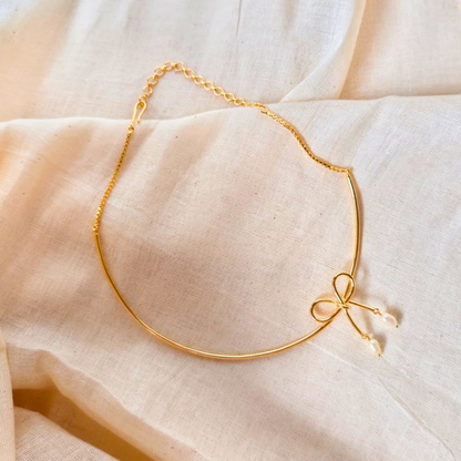 18K rhodium gold-plated brass bow necklace with baroque pearl drops