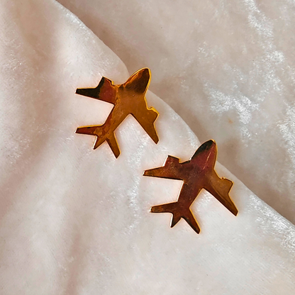 A pair of Gold Plated Aeroplane Earrings featuring minimalist airplane silhouettes crafted from brass and finished with a shiny 18k rhodium gold plating.








