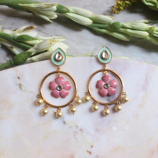Pair of Gulbahar Enamel Meena Earrings featuring hand-painted pink enamel flowers inside golden hoops, adorned with faux pearl drops and pastel teardrop studs with kundan-style accents
