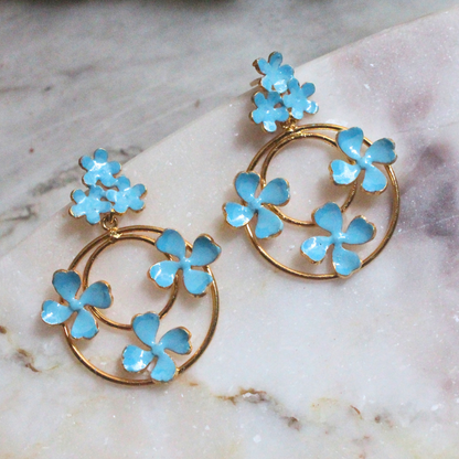 Blue Enamel Dangler Earrings featuring concentric gold-plated brass hoops adorned with delicate sky-blue enamel flowers