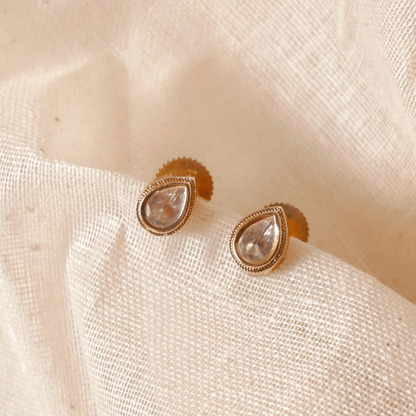 Handmade brass drop-shaped Kundan studs with gold rhodium finish and Kundan stone