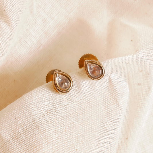Handmade brass drop-shaped Kundan studs with gold rhodium finish and Kundan stone